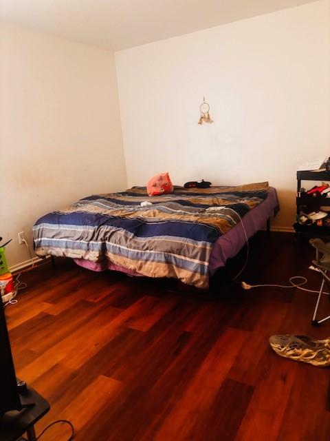 6200 W Tidwell Rd Unit 1701, Houston, TX 77092 - bedroom featuring wood finished floors