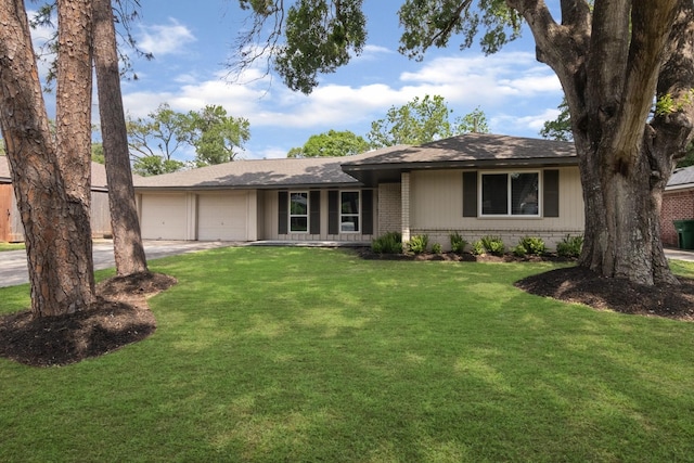 single story home with a front lawn, a garage, a shingled roof, driveway, and brick siding