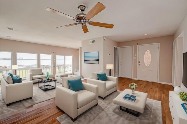 10 Mariner Village Dr, Pasadena, TX 77586 - living area featuring visible vents, ceiling fan, and wood finished floors