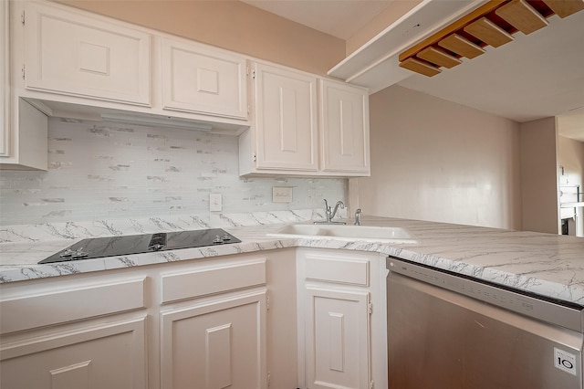 10 Mariner Village Dr, Pasadena, TX 77586 - kitchen with a sink, black electric cooktop, backsplash, white cabinetry, and dishwasher