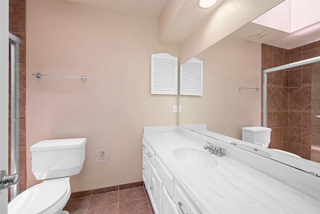 10 Mariner Village Dr, Pasadena, TX 77586 - bathroom with a tile shower, tile patterned flooring, toilet, vanity, and visible vents