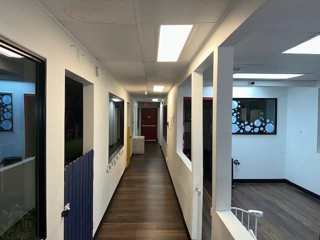 hall with dark wood-style flooring