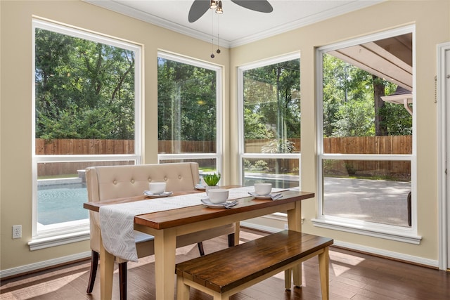 sunroom with ornamental molding and hardwood / wood-style floors