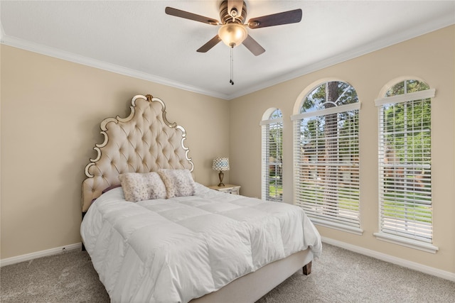 bedroom featuring baseboards, ornamental molding, ceiling fan, and carpet floors