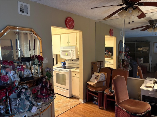 2800 Jeanetta St Unit 1110, Houston, TX 77063 - kitchen featuring white appliances, a ceiling fan, a textured ceiling, light wood-style floors, and light countertops