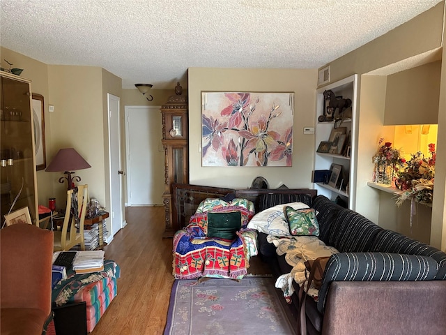 2800 Jeanetta St Unit 1110, Houston, TX 77063 - living room with wood finished floors and a textured ceiling