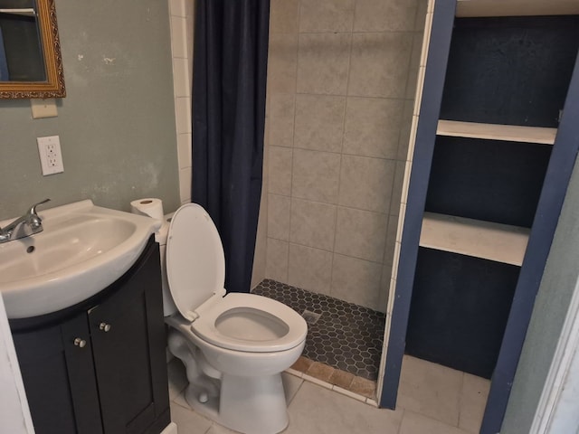 full bath featuring toilet, tile patterned flooring, a shower stall, and vanity