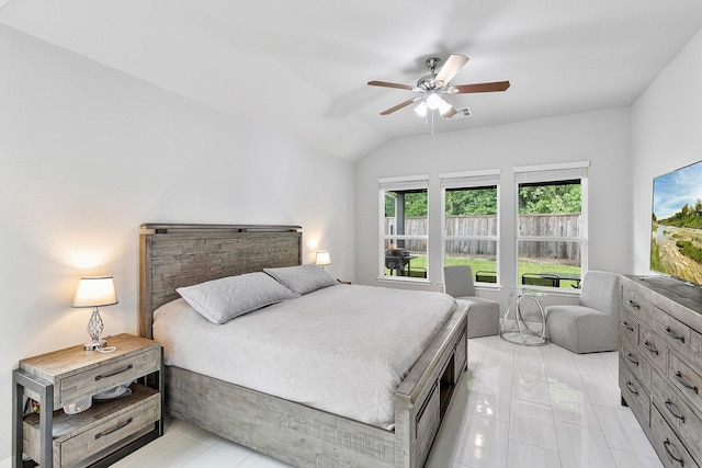bedroom with visible vents, ceiling fan, and lofted ceiling
