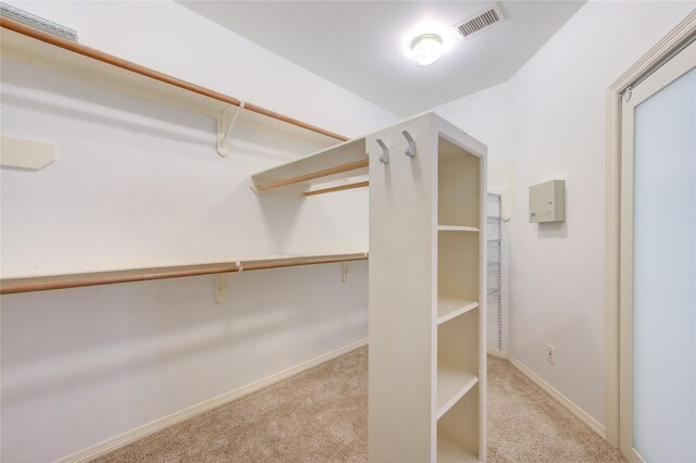spacious closet with carpet and visible vents