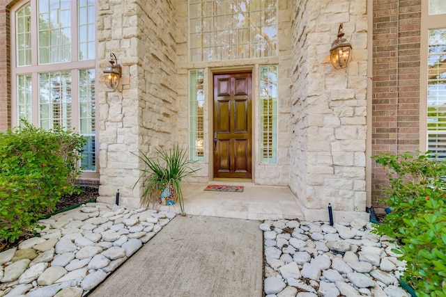 entrance to property with stone siding