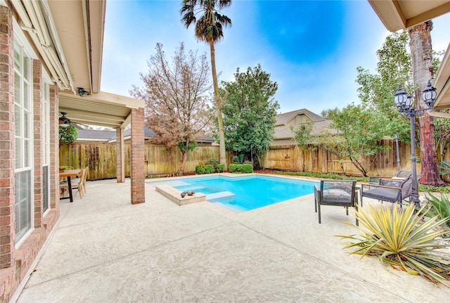 view of pool featuring a patio, a fenced backyard, and a fenced in pool