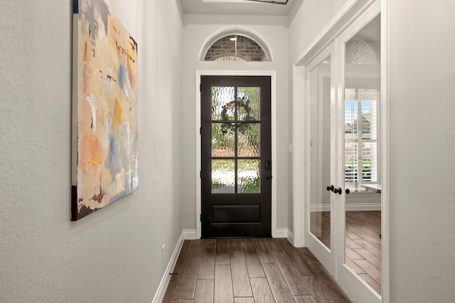 16711 Arboleda Dr, Humble, TX 77346 - entryway with wood finished floors, french doors, baseboards, and a textured wall