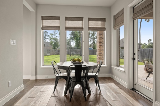 16711 Arboleda Dr, Humble, TX 77346 - dining room featuring plenty of natural light, wood finished floors, and baseboards