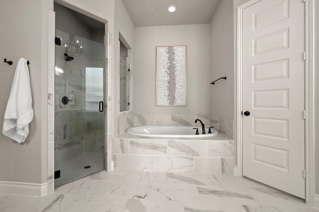 16711 Arboleda Dr, Humble, TX 77346 - bathroom with a garden tub, a shower stall, marble look tiles, baseboards, and recessed lighting