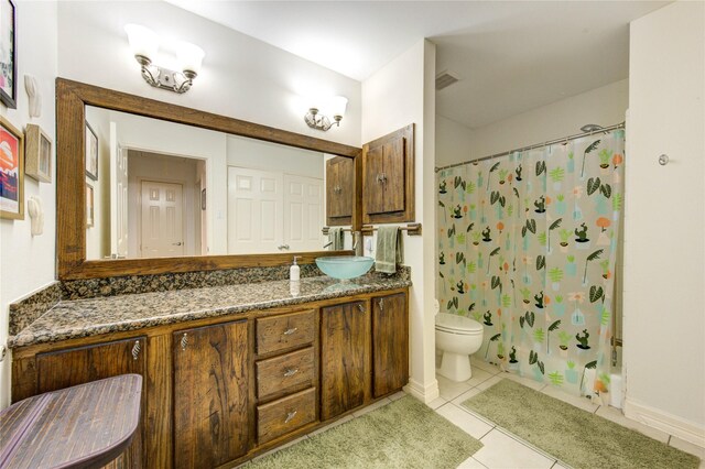 11815 Poplar Creek Dr, Houston, TX 77077 - bathroom with a shower with curtain, tile patterned flooring, baseboards, vanity, and toilet