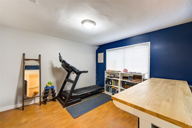 11815 Poplar Creek Dr, Houston, TX 77077 - workout room featuring wood finished floors