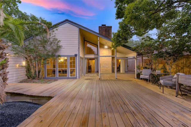 wooden deck featuring fence