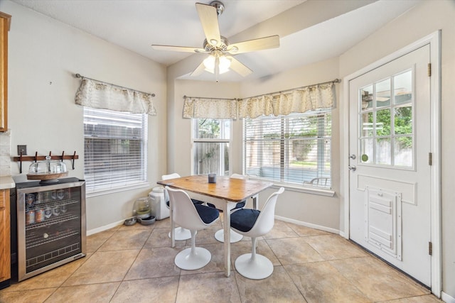 13907 Carrington Ln, Cypress, TX 77429 - dining space with wine cooler, baseboards, light tile patterned flooring, and a ceiling fan