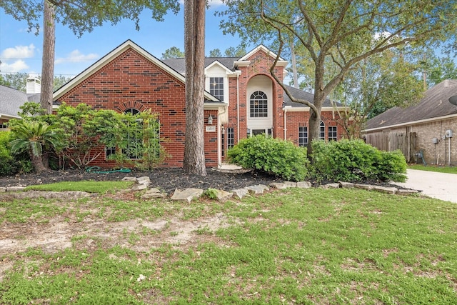 13907 Carrington Ln, Cypress, TX 77429 - traditional-style house with brick siding and a front lawn