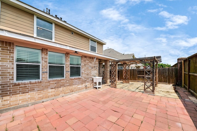 view of patio / terrace with a pergola and a fenced backyard