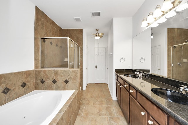 full bath with a shower stall, a sink, visible vents, a garden tub, and a ceiling fan
