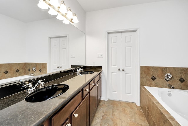 full bath with double vanity, a bath, and a sink