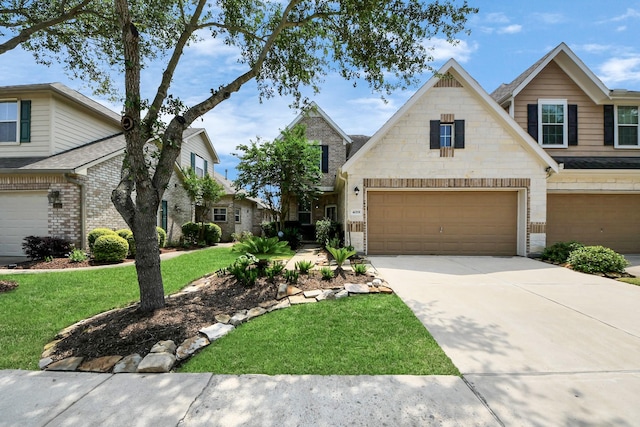 view of front of property featuring a front yard, driveway, an attached garage, and brick siding