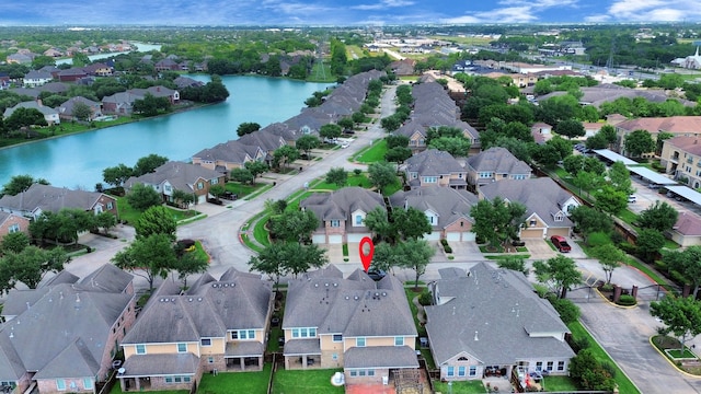 bird's eye view featuring a residential view and a water view