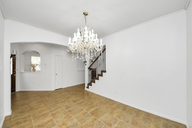 entryway with arched walkways, stairs, a chandelier, ornamental molding, and baseboards