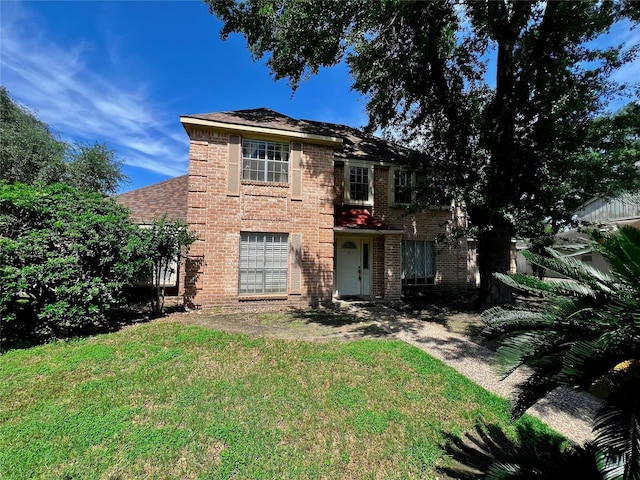 16418 York Minster Dr, Spring, TX 77379 - view of front of property with a front lawn and brick siding