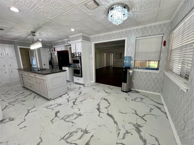 16418 York Minster Dr, Spring, TX 77379 - kitchen with ornamental molding, dark countertops, a chandelier, white cabinetry, and an ornate ceiling