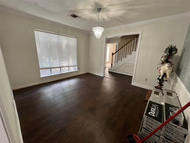 16418 York Minster Dr, Spring, TX 77379 - empty room with dark wood finished floors, a chandelier, stairway, ornamental molding, and baseboards