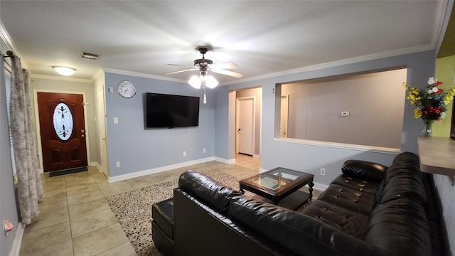 living area featuring light tile patterned floors, ceiling fan, ornamental molding, and baseboards