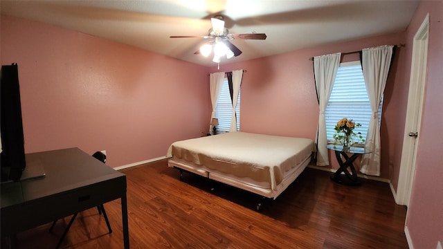 bedroom with wood finished floors, ceiling fan, and baseboards