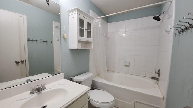 bathroom featuring shower / bath combo with shower curtain, toilet, and vanity