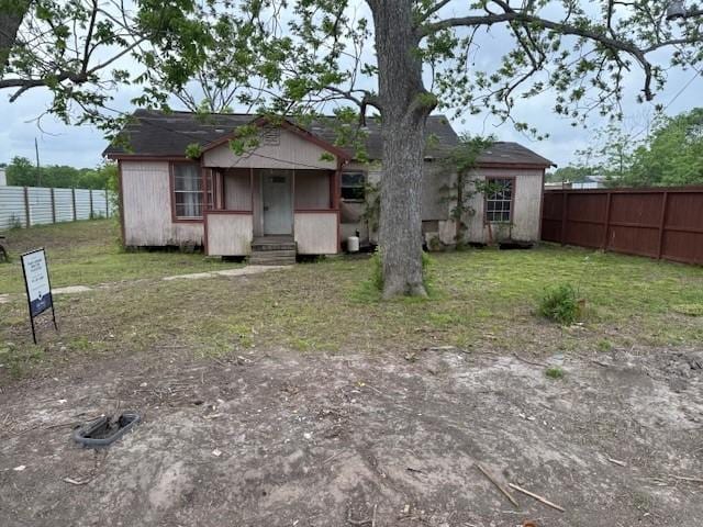 view of front of home with fence