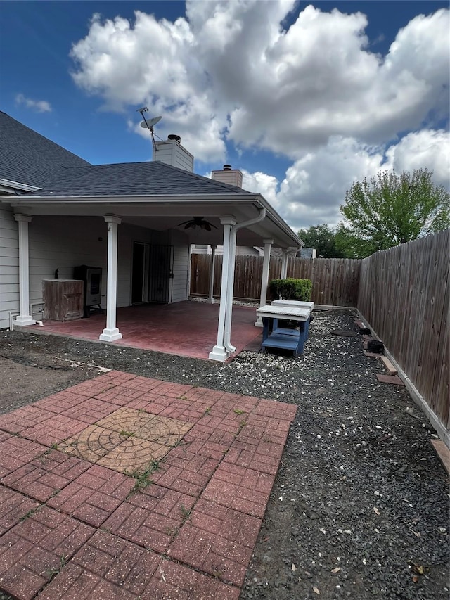 view of patio / terrace with a ceiling fan and a fenced backyard