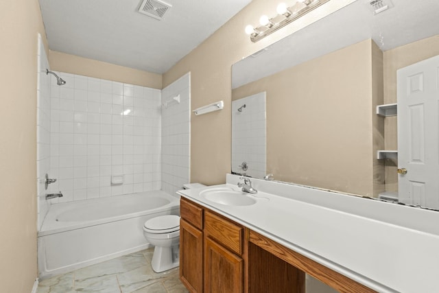 7931 Raven Creek Ln, Cypress, TX 77433 - bathroom featuring visible vents, toilet, bathtub / shower combination, and vanity