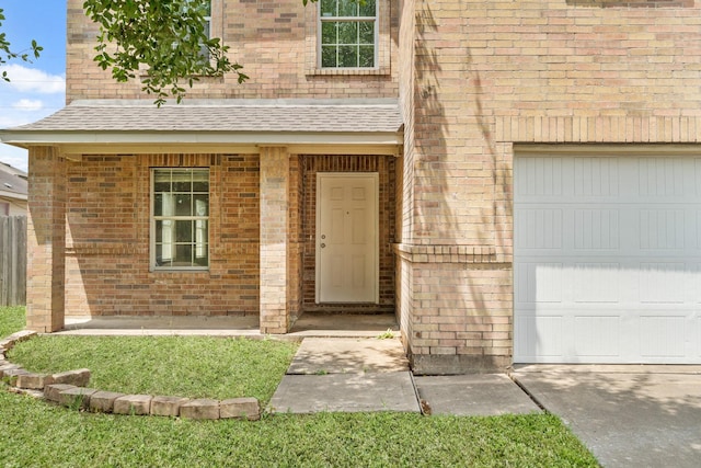 7931 Raven Creek Ln, Cypress, TX 77433 - entrance to property with a garage, brick siding, and a shingled roof