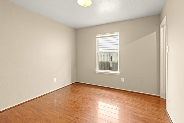 7931 Raven Creek Ln, Cypress, TX 77433 - unfurnished room featuring wood finished floors and baseboards