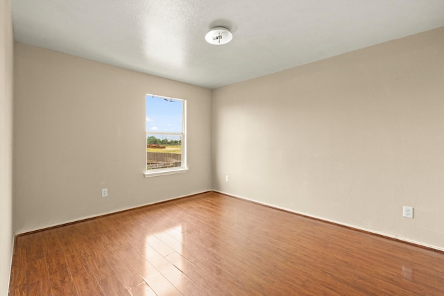 7931 Raven Creek Ln, Cypress, TX 77433 - empty room with wood finished floors and baseboards