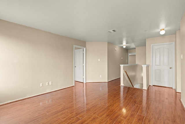 7931 Raven Creek Ln, Cypress, TX 77433 - unfurnished room with baseboards, visible vents, and wood finished floors