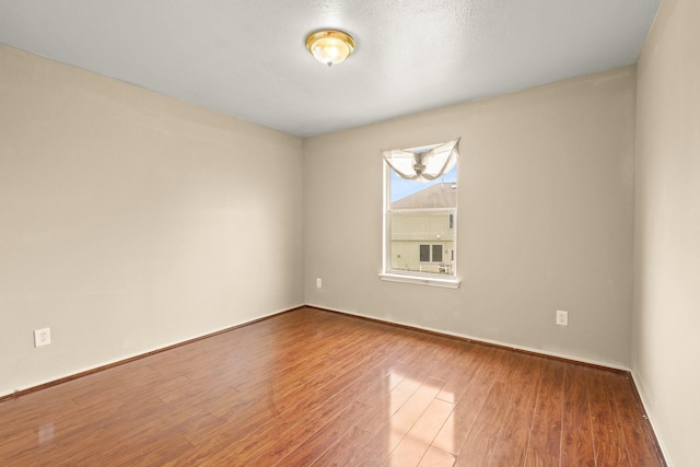 7931 Raven Creek Ln, Cypress, TX 77433 - spare room featuring wood finished floors and baseboards