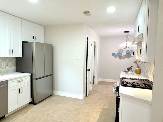 kitchen featuring visible vents, backsplash, white cabinetry, light countertops, and appliances with stainless steel finishes