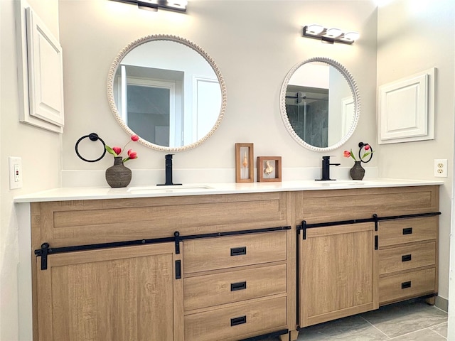 full bathroom featuring double vanity and a sink