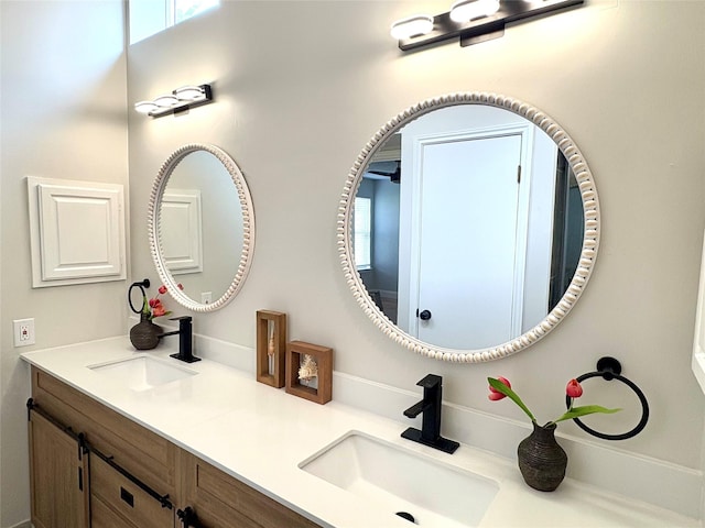 bathroom featuring double vanity and a sink