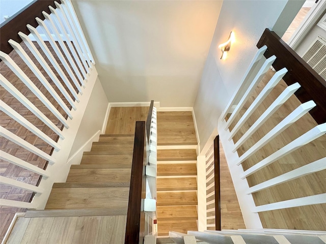 stairs featuring a towering ceiling