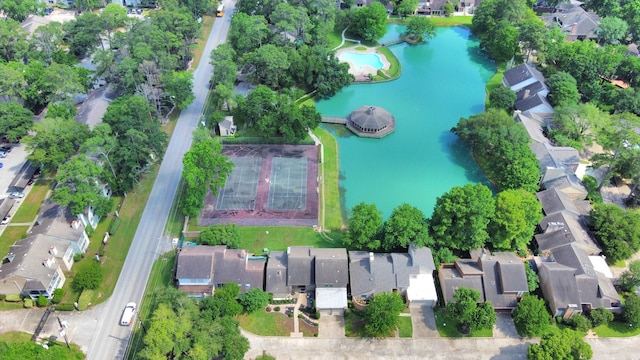 drone / aerial view featuring a water view and a residential view