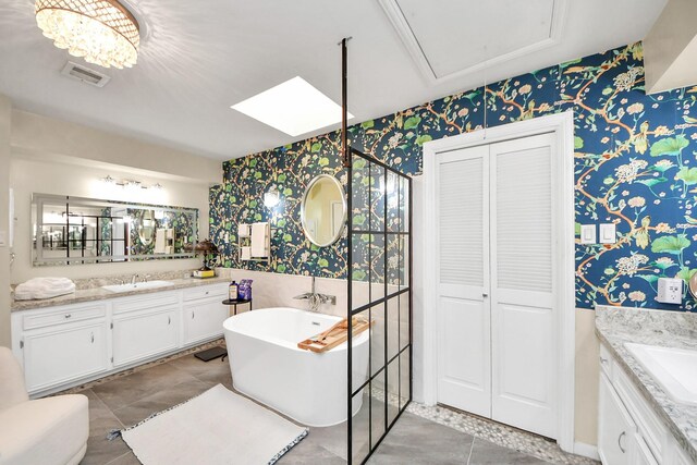 200 Old Bridge Lk, Houston, TX 77069 - bathroom with visible vents, vanity, and wallpapered walls