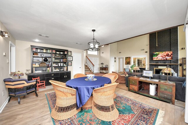 200 Old Bridge Lk, Houston, TX 77069 - dining room with visible vents, stairs, wood finished floors, and an inviting chandelier